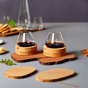 Aequilibrium glasses by Audacem with wooden coasters during dinner