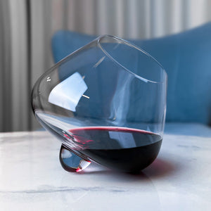 Aequilibrium red wine glass on a marble table by Audacem