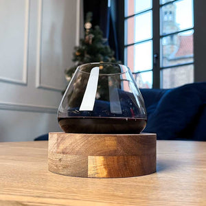 Hand-blown Aequilibrium glass on handcrafted wooden coaster by Audacem