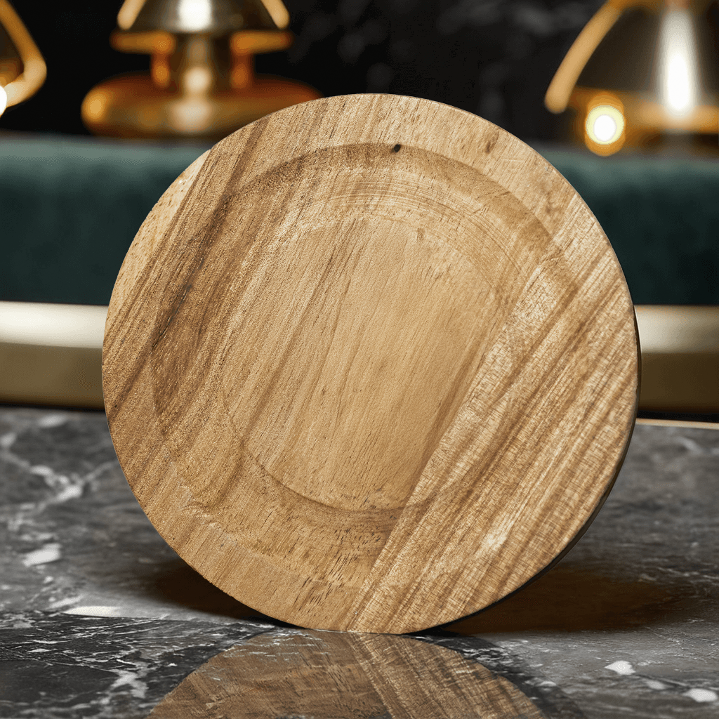 Audacem round wooden coaster flat side displayed on marble table with golden decorative background elements